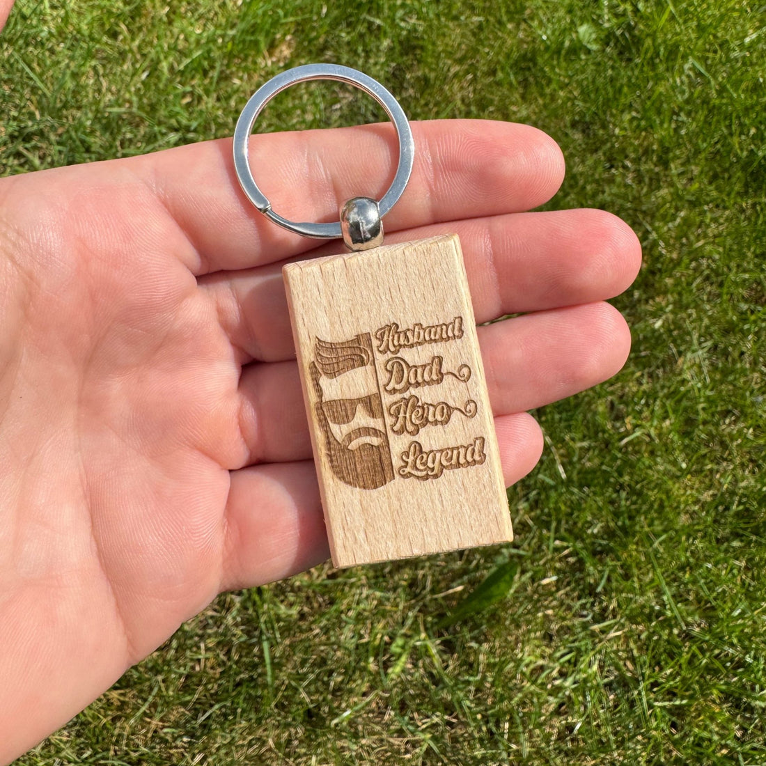 Engraved wooden keyring with dad design held in hand – personalised wooden keyring – Etch 'N' Shine