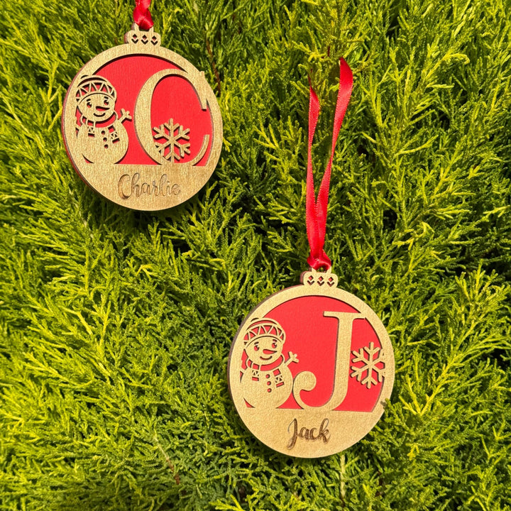 Two wooden baubles with custom initials and names on red backing – personalised Christmas ornaments – Etch 'N' Shine