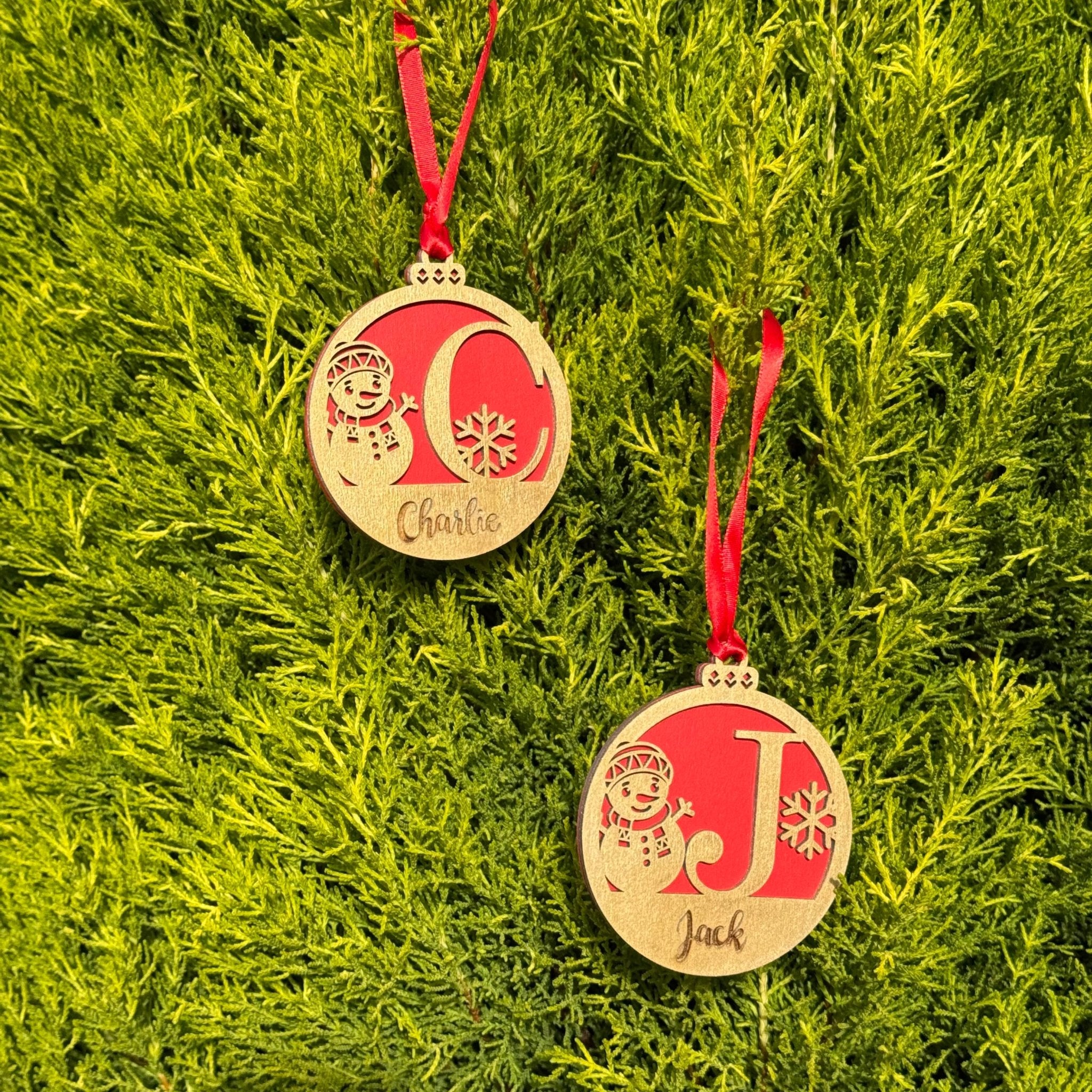 Two wooden baubles with engraved initials and custom name – personalised Christmas ornaments – Etch 'N' Shine