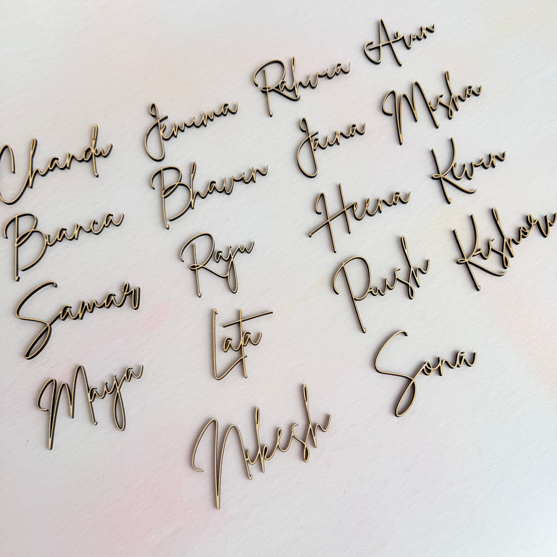 Personalised wooden name place settings for weddings, custom laser cut table names in plywood for elegant table seating