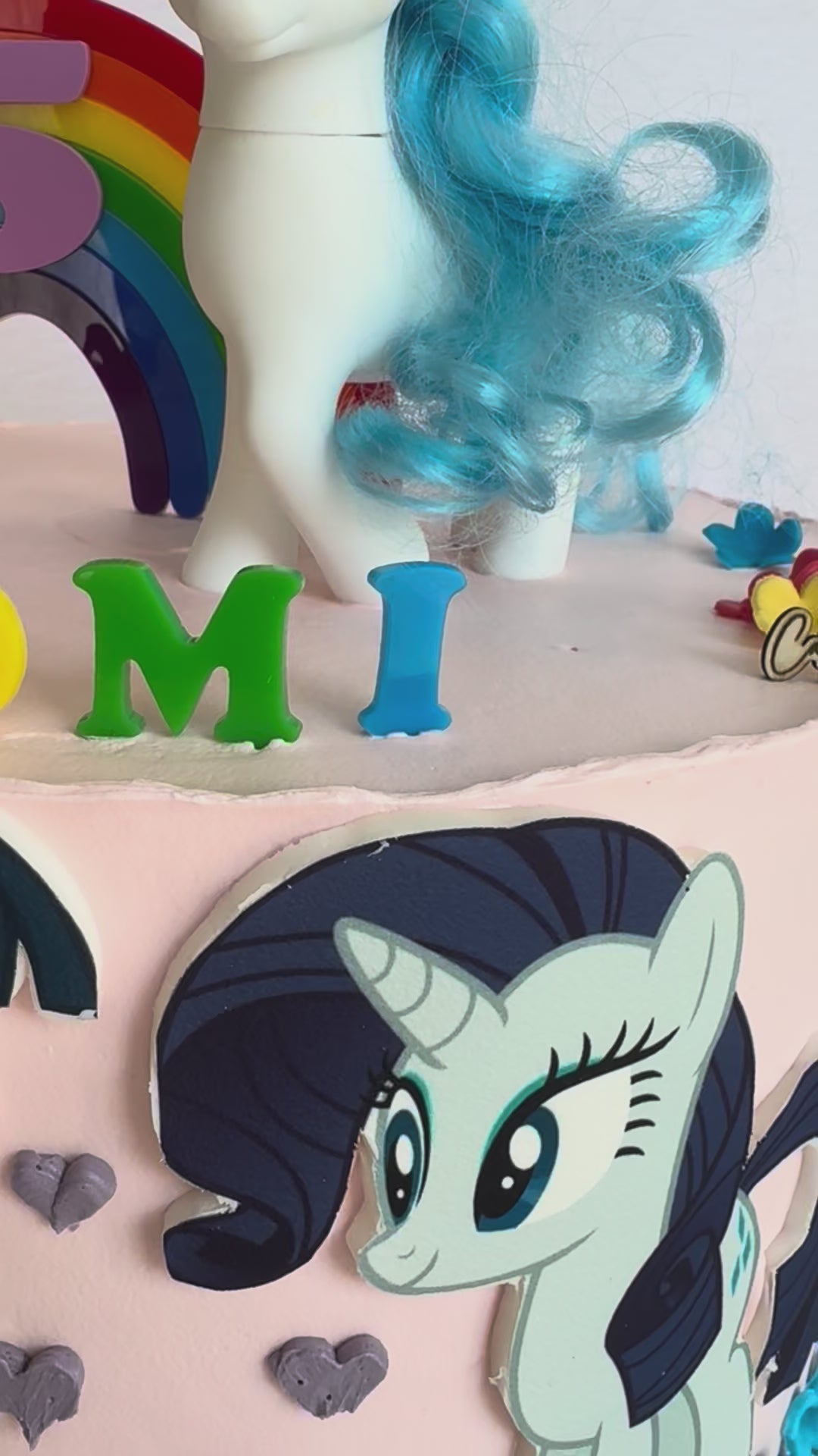 Video of the rainbow number and name topper set on a finished birthday cake – Etch 'N' Shine