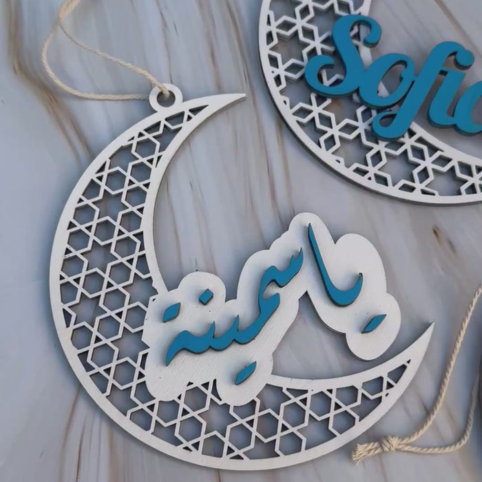 Video showing a set of personalised  name crescent  in white and blue.