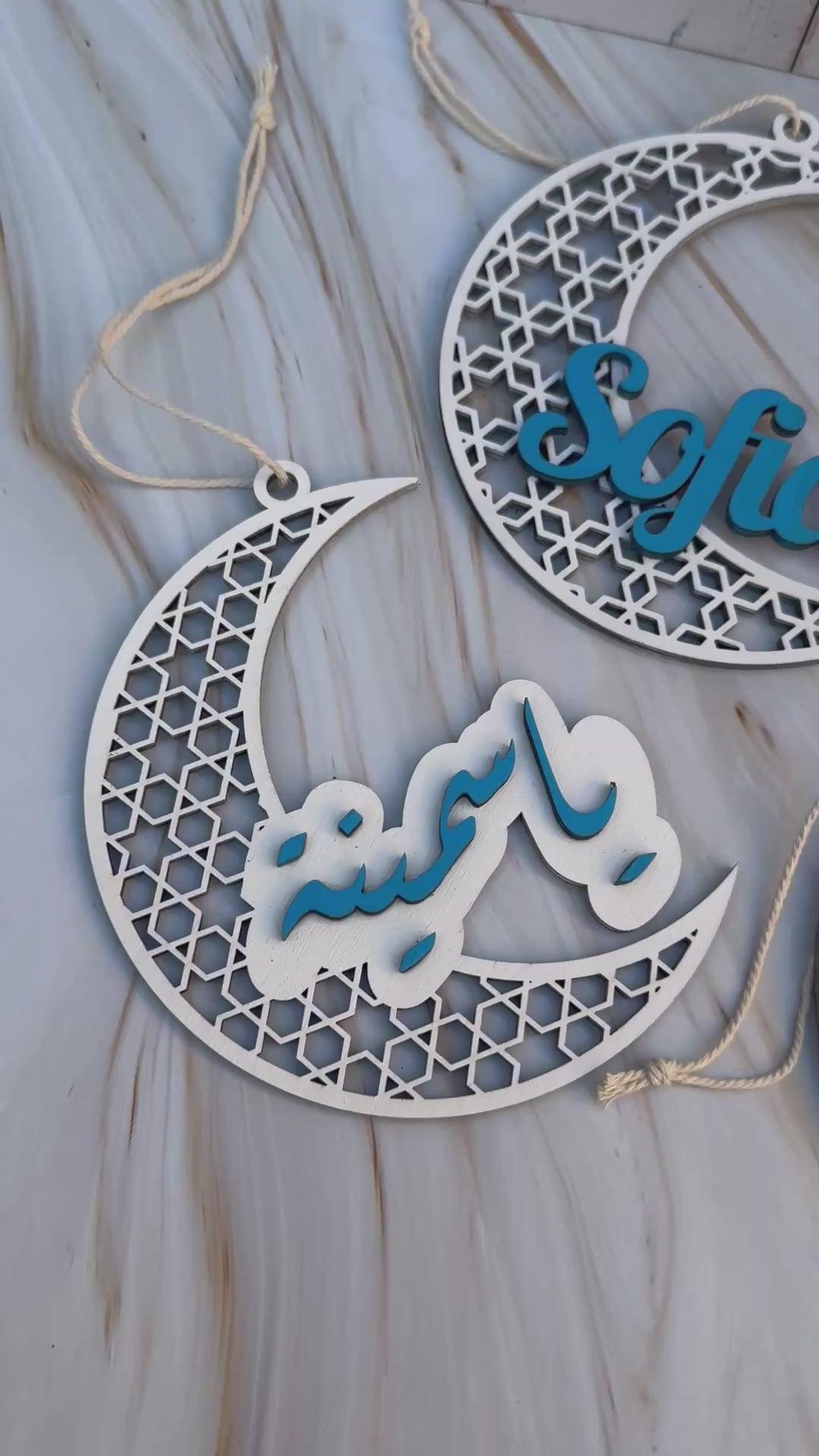 Video showing a set of personalised  name crescent  in white and blue.
