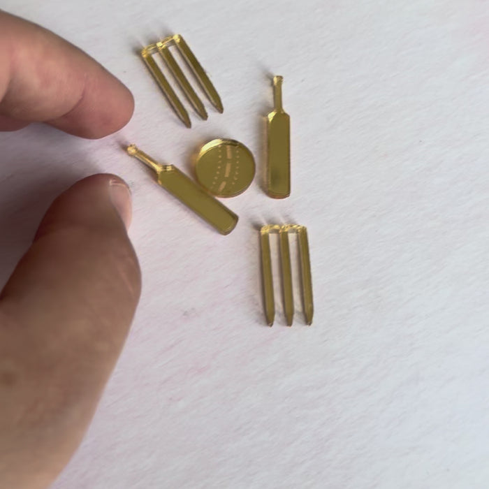 Video of gold acrylic cricket-themed cake topper pieces – bespoke laser-cut topper – Etch 'N' Shine
