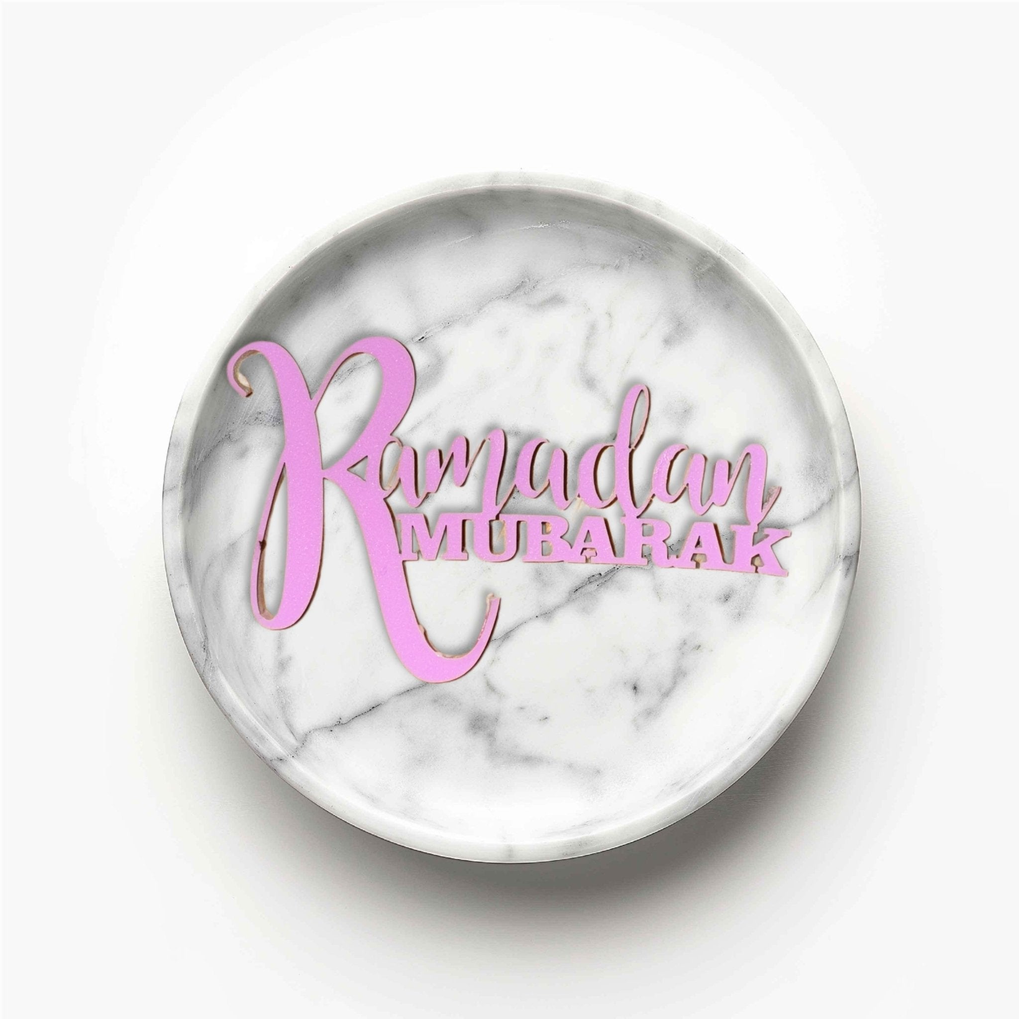 Pink laser-cut acrylic cake topper with custom text on a marble-effect round dish – acrylic cake topper – Etch 'N' Shine