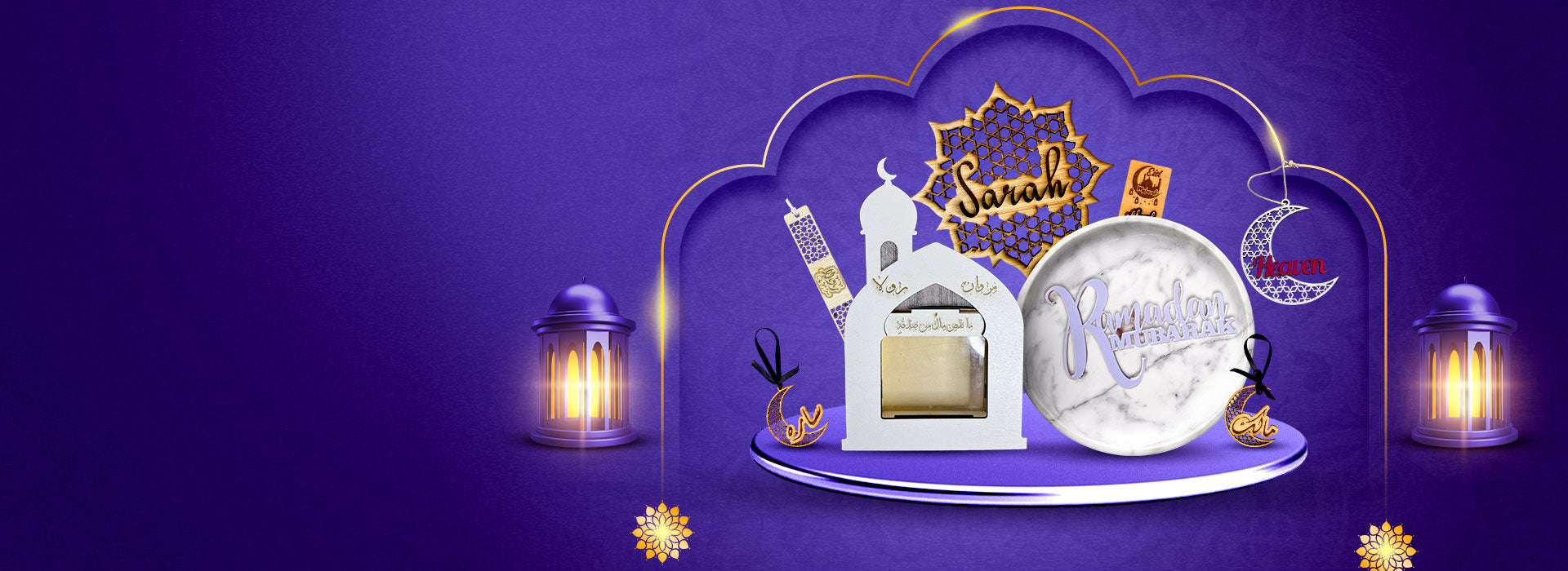 Decorative setup with a mosque model, lanterns, and 'Mubarak' card on a purple background