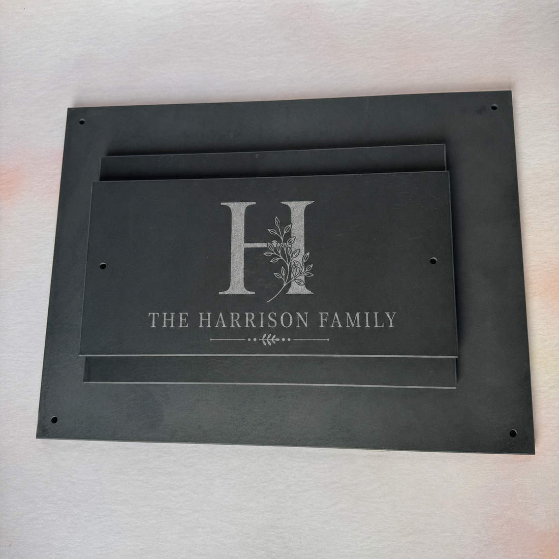 Engraved slate house sign with custom name and number on a dark surface – personalised slate house sign – Etch 'N' Shine