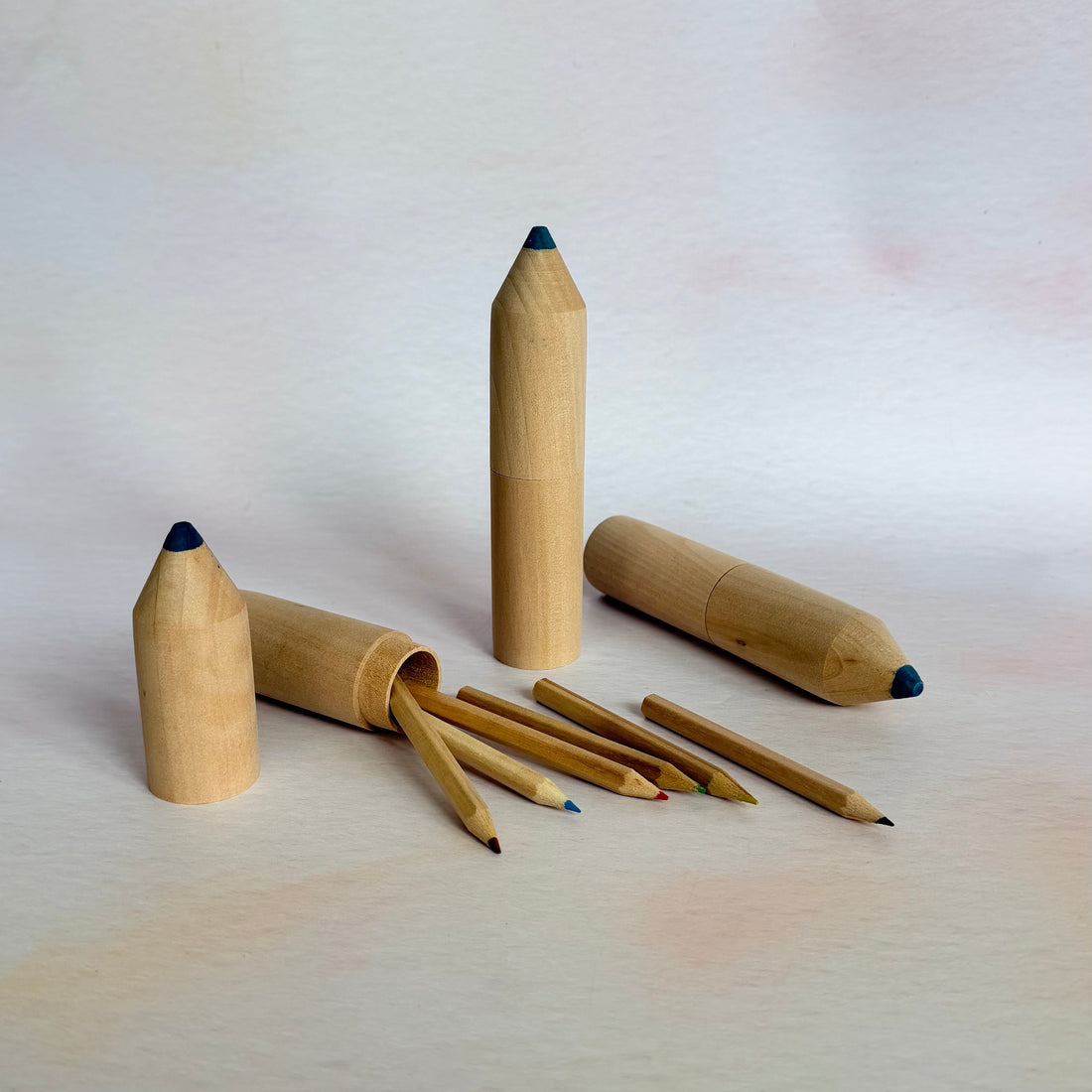 Wooden pencils with black tips on a white background